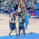 Marcus Morris Sr. tries to keep Ja Morant from the hoop by attempting to remove his head from his neck.
